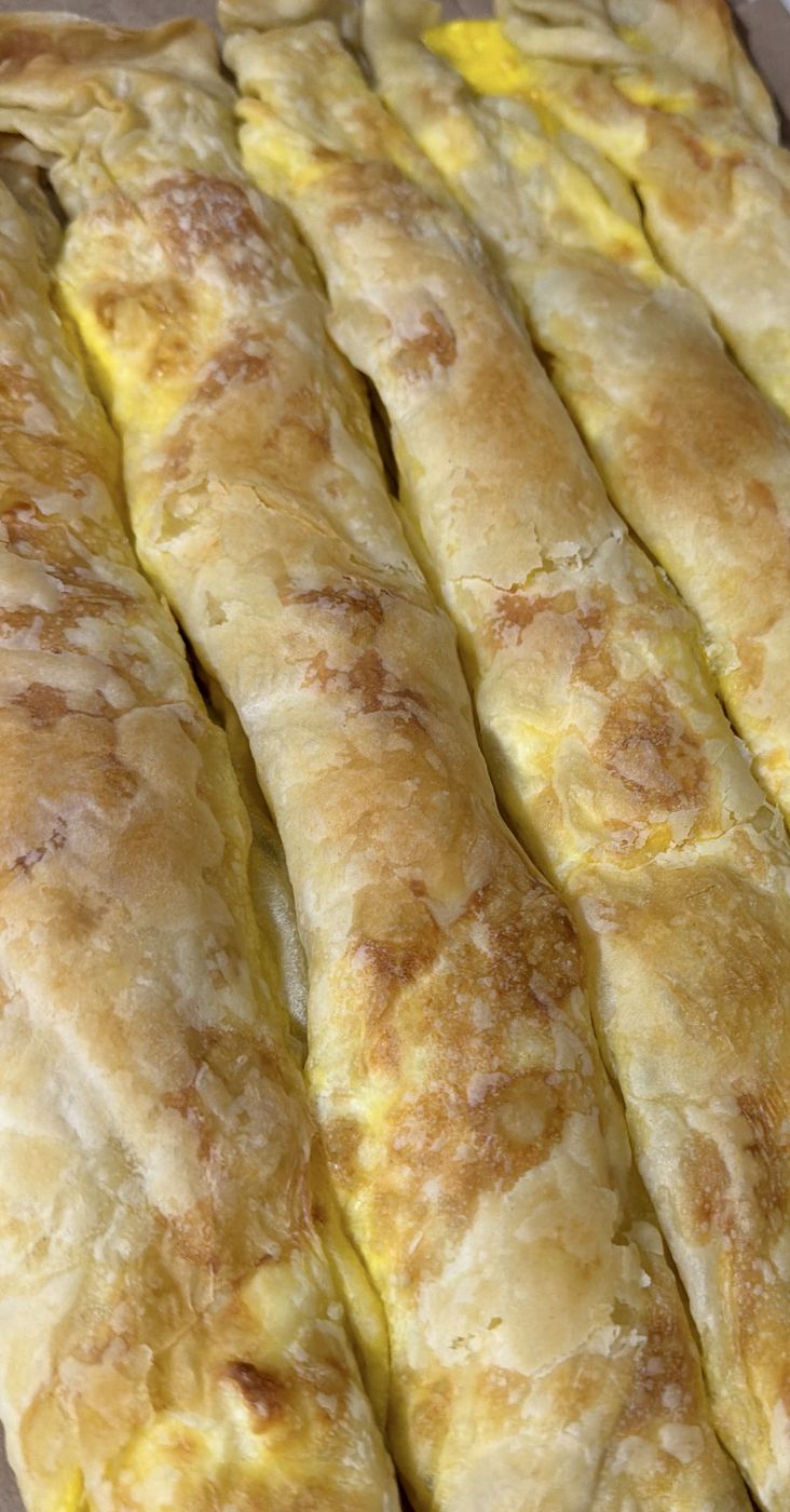 Hand-rolled golden pastry, baked side by side on the tray