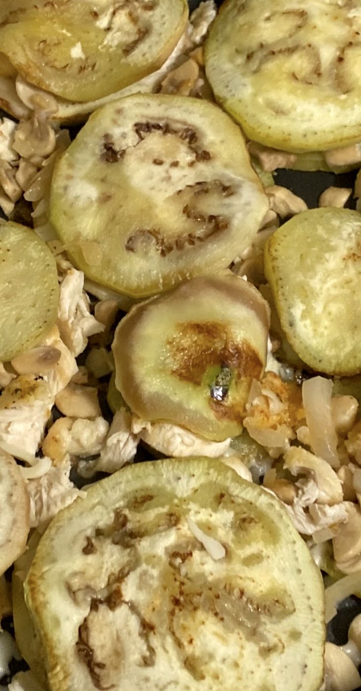 Eggplant rounds roasting with mushrooms and herbs