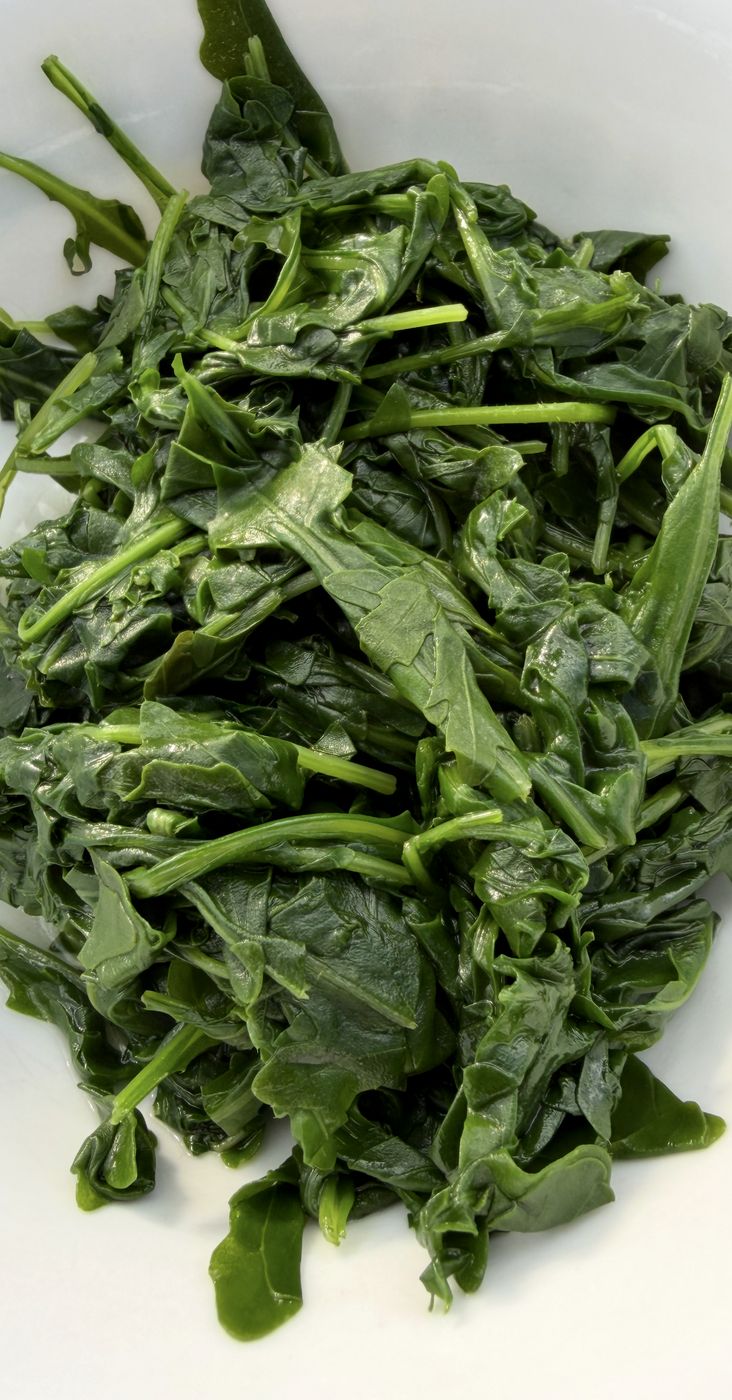 Sautéed greens on a white plate